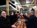 At last, it’s the Glorious 12th! Thirsty drinkers rush to pubs in the snow at midnight