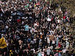 Thousands of anti vaccine passport activists march through central London
