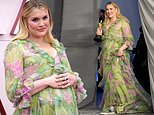 Oscars 2021: Emerald Fennell shows off baby bump in billowing gown as she walks the pink carpet
