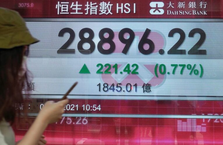 Asian shares mostly higher; Tokyo slips as virus cases surge