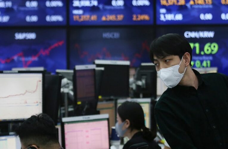 Asian stocks mixed after Wall St rally on economic optimism