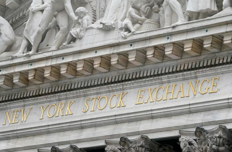 Stocks wobble as investors turn cautious after record highs