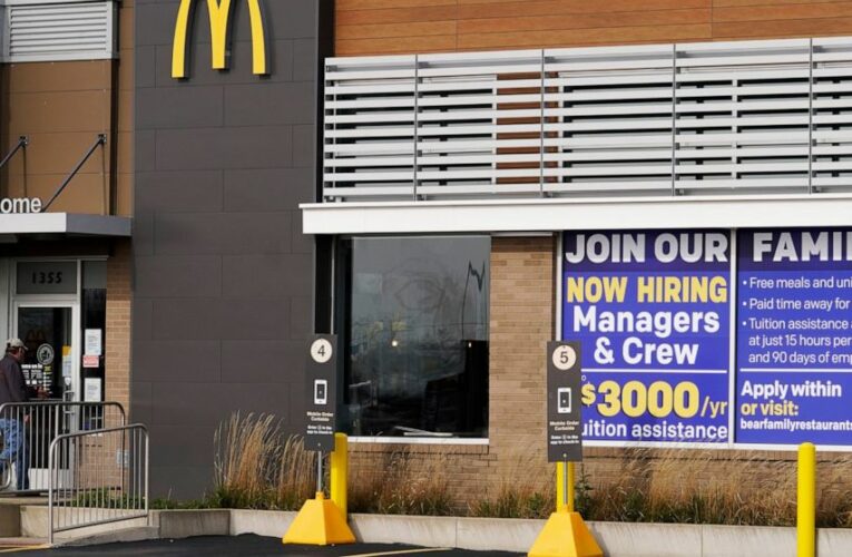 US jobless claims fall to 547,000, another pandemic low