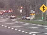 Impatient drivers REVERSE up a one-way entrance ramp to avoid traffic