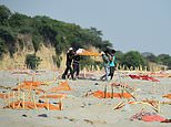 Police urge villagers in India not to bury their dead in rivers after bodies washed up by Ganges