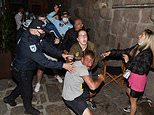 Chelsea and Man City supporters clash in Porto as riot police threaten warring fans with batons