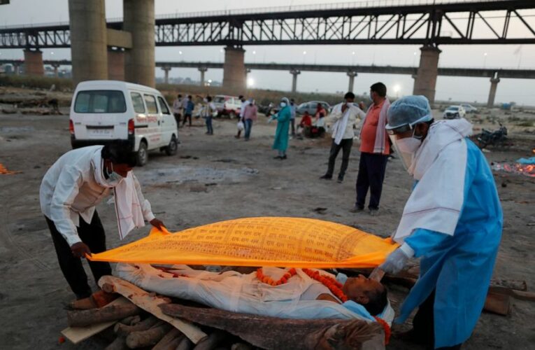 The Latest: France welcomes EU curb on AstraZeneca vaccine