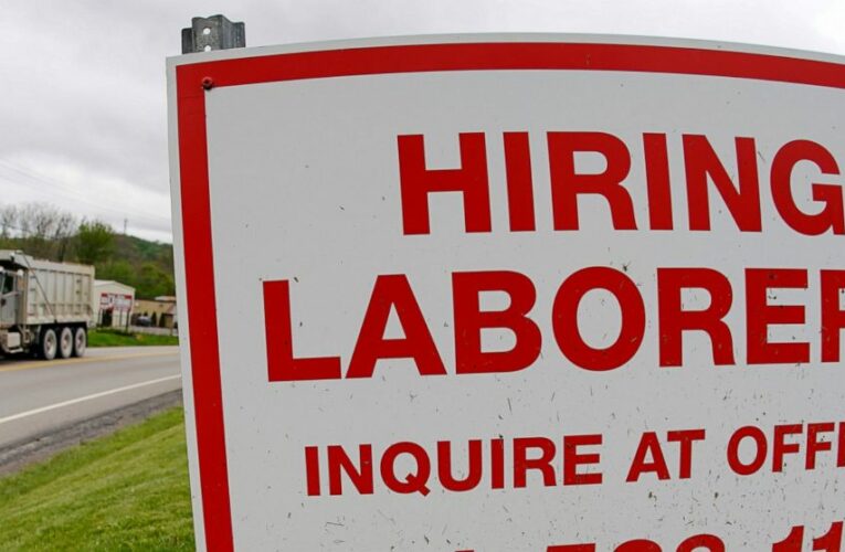 US jobless claims fall to 406,000, a new pandemic low