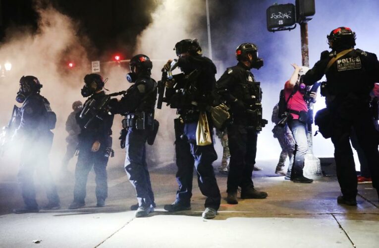 Dozens of Portland police officers resign from team that responds to protests after member is indicted