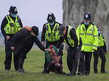 Druids DEFY Covid ban at Stonehenge: Police move on hundreds at Neolithic site