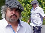 Pete Doherty sports long grey locks and eats a wedge of cheese in France