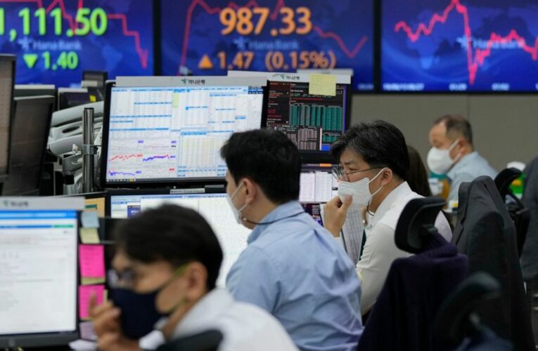 Asian shares mixed as China reports jump in inflation