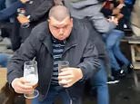 VIDEO: England fan saves his beer from jumping fans