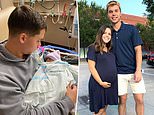 Dad, 21, cradles his newborn son after pregnant wife, 22, was killed when robbers crashed into her 