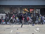 Shopkeepers fire on looters to protect their businesses as South Africa deploys troops to curb riots