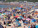 Looks a lot like freedom day! Tens of thousands of Brits stampede to beaches