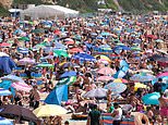 Looks a lot like freedom day! Tens of thousands of Brits stampede to beaches
