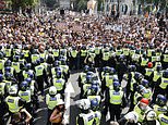 Anti-vax louts lob bottles at police during clash outside Parliament