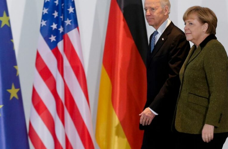 Neck rubs, tapped phones: Merkel has history with US leaders