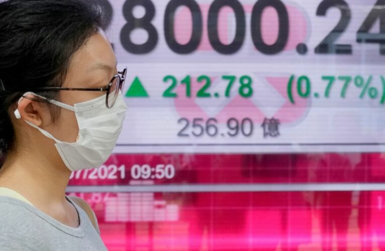 Asian shares trading mixed as China reports growth slowed