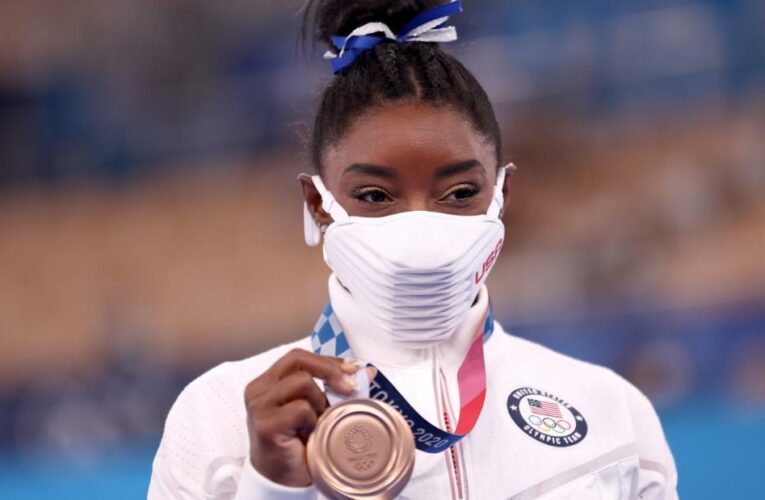 The US gymnast overcame mental health issues to win her seventh Olympic medal. China’s Guan Chenchen took the gold and Tang Xijing the silver.