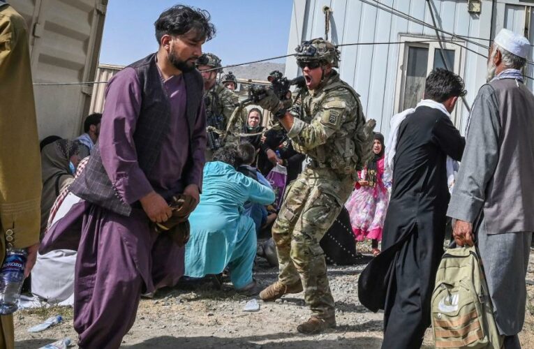 Afghans watch nervously as Taliban regime takes shape, and US and its allies continue frantic exit