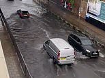 London FLOODS: Roads are left underwater as Britain is lashed by heavy downpours and thunderstorms