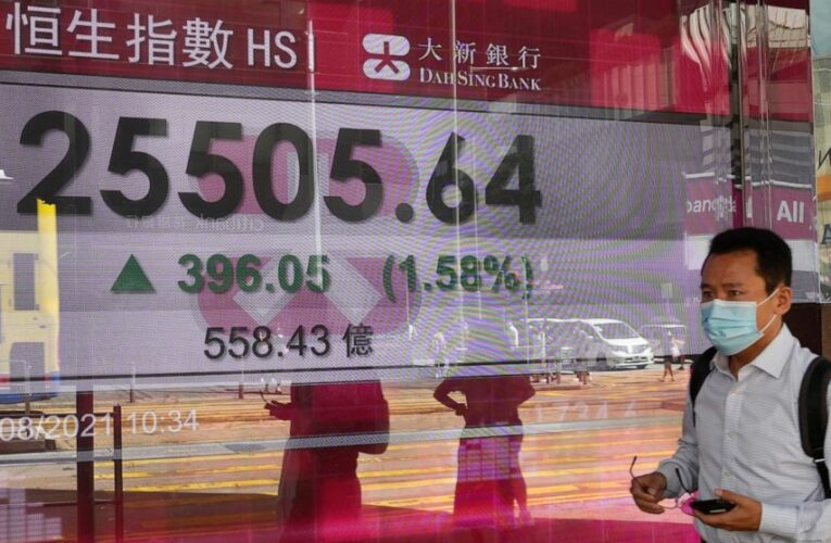 Modest gains nudge Nasdaq above 15,000 for the first time