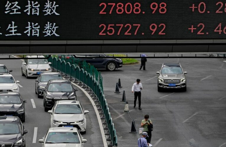 Asian stocks slip following record Wall Street charge