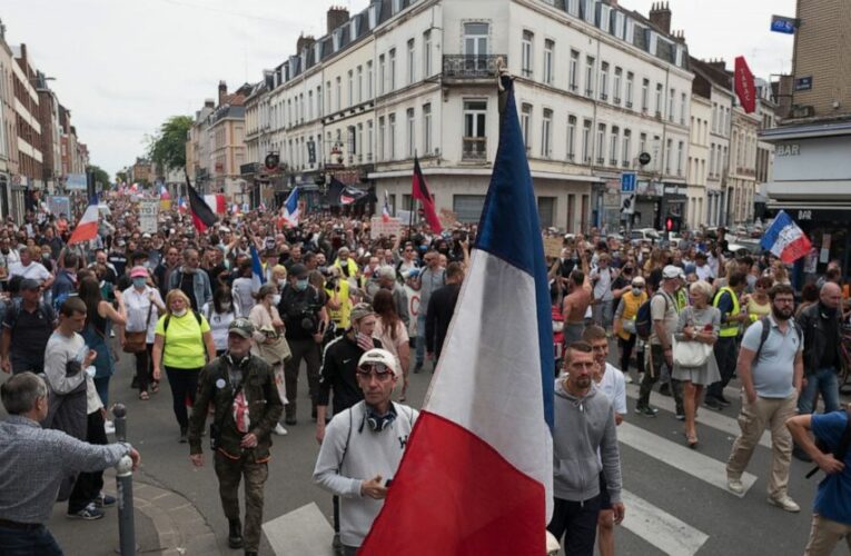 French virus health pass in full use but protests keep going
