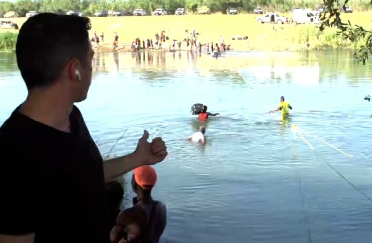 Migrants cross Rio Grande River during CNN reporter’s liveshot