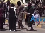 Taliban fighters beat female protesters and open fire to disperse them as the Islamists ban rallies