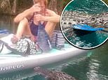Terrifying moment Florida woman on a paddleboard is stalked by aggressive alligator