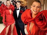 Karlie Kloss is the lady in red with a stunning Carolina Herrera rose petal dress at the Met Gala