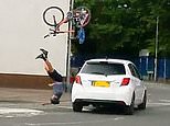 Terrifying moment cyclist, 27, was sent flying into the air after being hit by a car