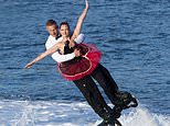 Romantic flyboarder stuns crowd with 007-style tricks… and a marriage proposal 