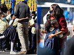 Meghan and Harry hug kids during visit to Harlem school