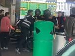 Moped rider launches flying kick against another rider as anger boils over at packed petrol station