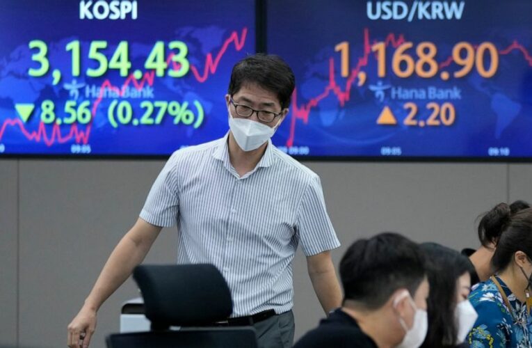 World shares slip as Fed signals ‘downshift’ in economy