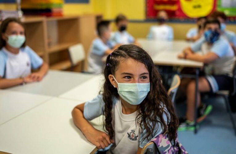 The Latest: Students return to classes in Spain fully masked