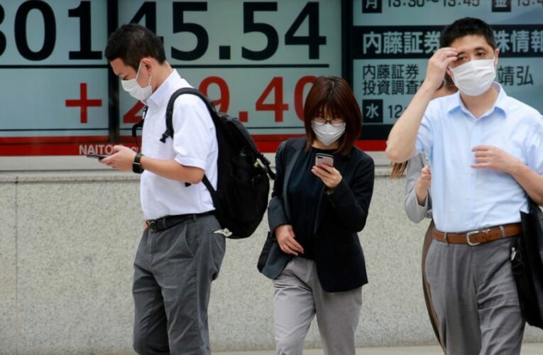 Asian shares slip as Fed signals ‘downshift’ in economy