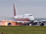 747 cargo jet bursts into flames as it lands at East Midlands airport with a loud bang 