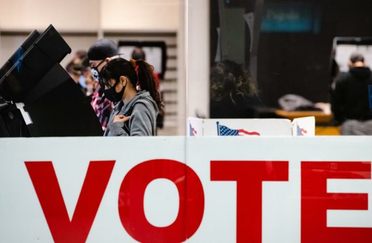The law bans 24-hour and drive-thru voting, impedes mail-in ballots and empowers partisan poll watchers. Federal officials say it will disenfranchise eligible voters.