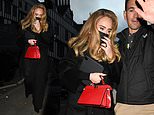 Adele sports a band on her wedding finger leaving a studio in London
