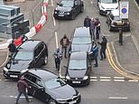 Dramatic moment armed police swooped on two men just 500 yards from Obama speech