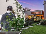 Travis Scott is seen pacing outside his $14million Houston mansion