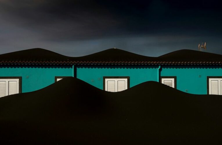 AP PHOTOS: A slow motion burial awaits in volcano no-go zone