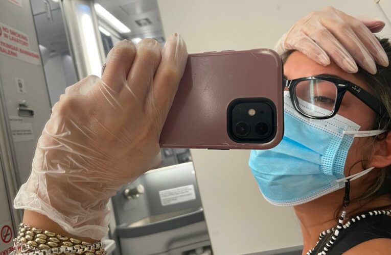 Woman isolates in plane bathroom after testing positive