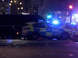 Gunman is shot dead in Kensington after raiding a bank and a bookmakers in broad daylight 