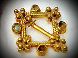 Father-of-two, 44, finds £100,000 medieval brooch buried on farmland while metal detecting